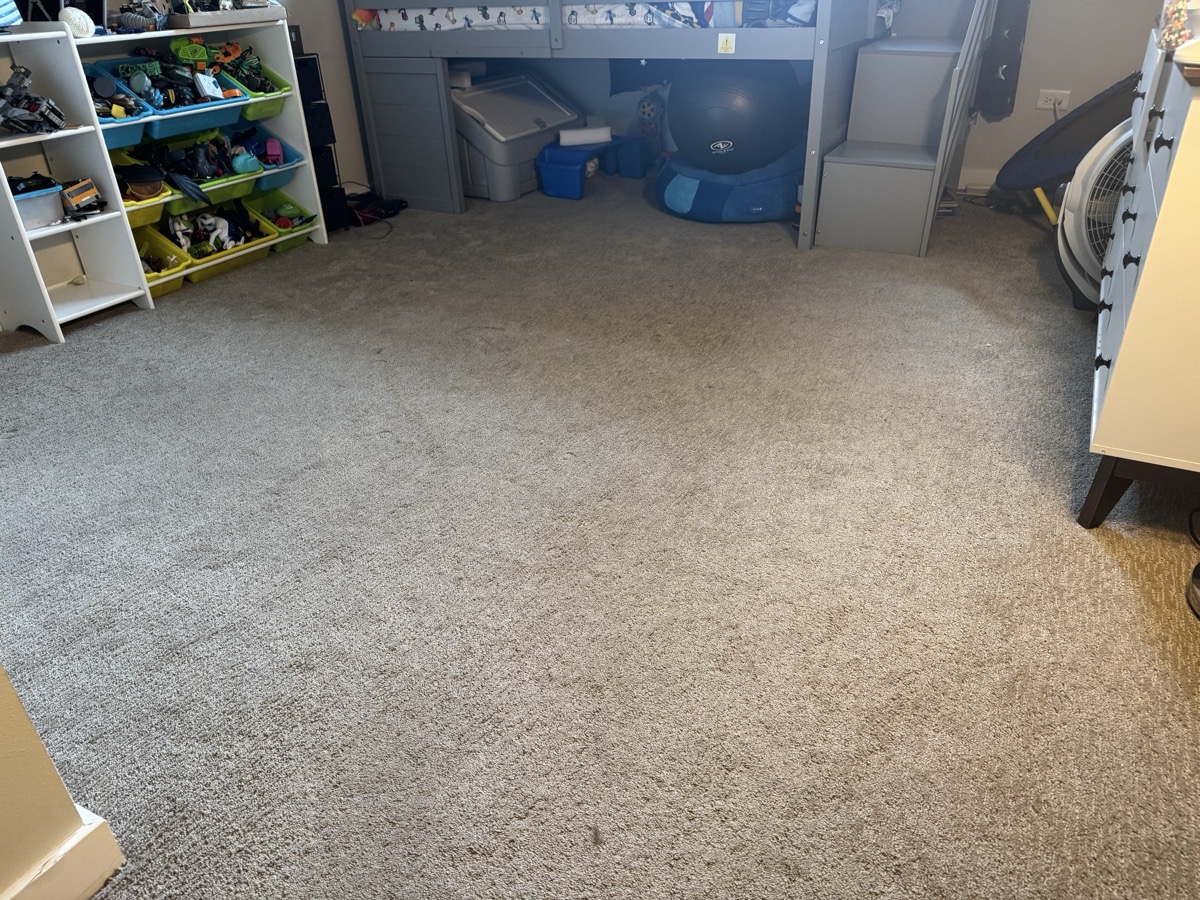 Before: Carpeted bedroom with traffic soil and scattered spots, then the room after cleaning