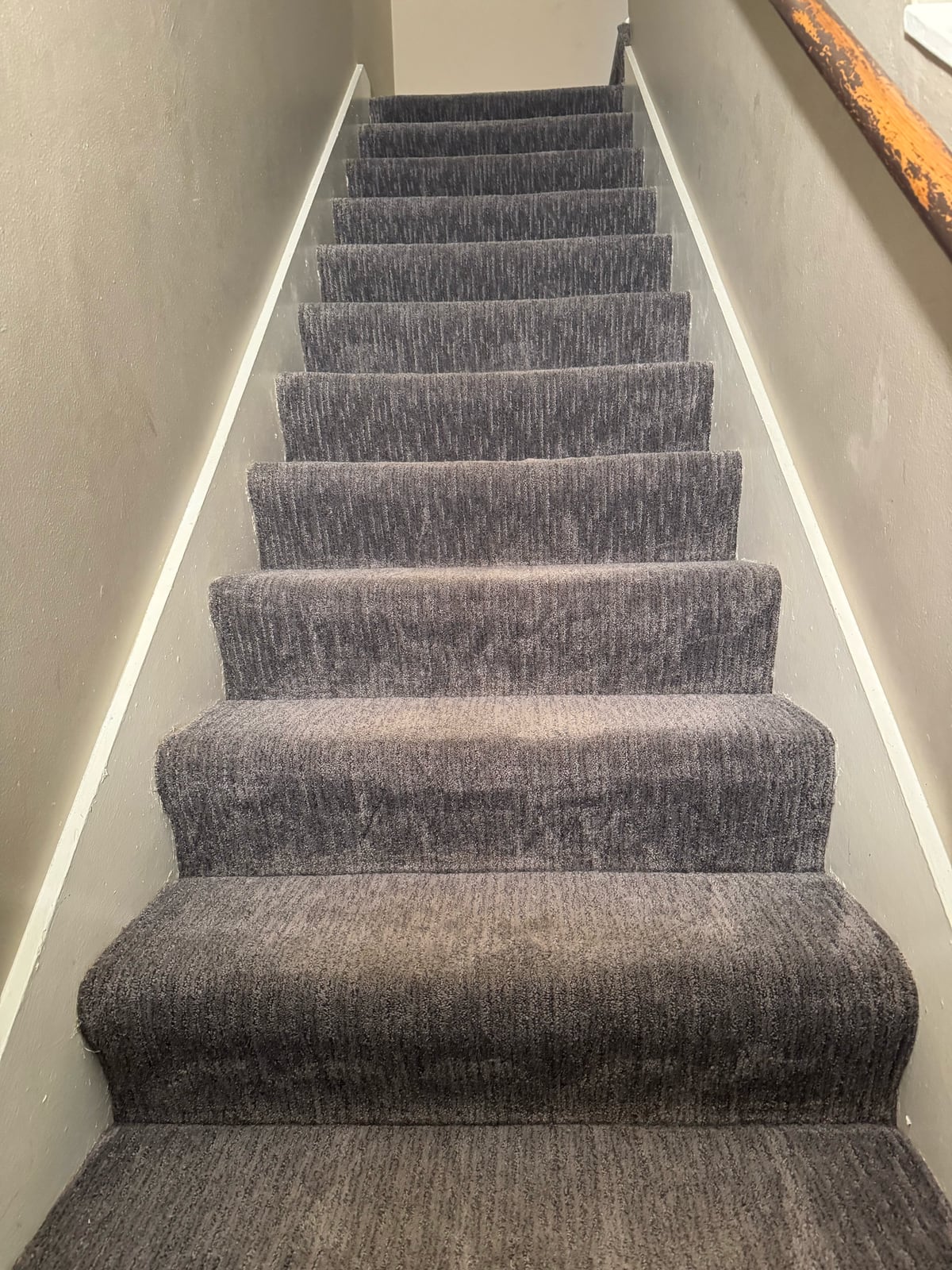 After: Gray carpeted staircase with heavy traffic soil, then the same staircase after cleaning